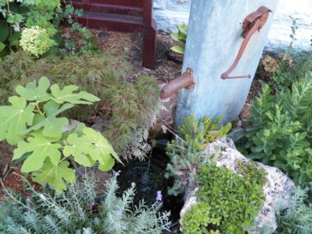 Your water feature doesn't need to be a giant. Even a small fountain can add the sound your ears long for.